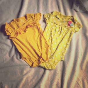 Two, yellow summer onesies with polka dots